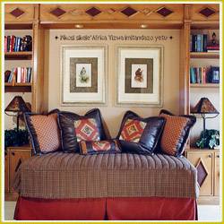 style wall lettering decal above sofa in African bedroom