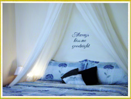 bedroom wall decal words below crown curtain in bedroom