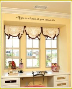 kids room decal on wall above study area in teen's room