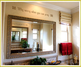 inspirational wall decal art above large mirror in bathroom